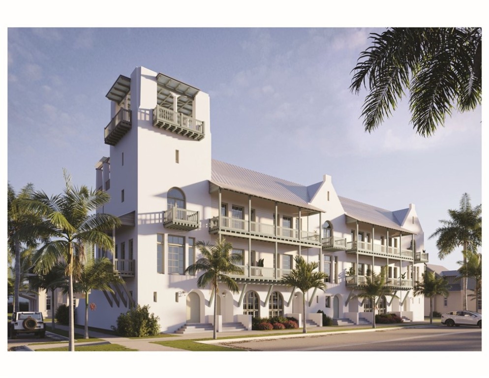 a front view of a building with palm tree