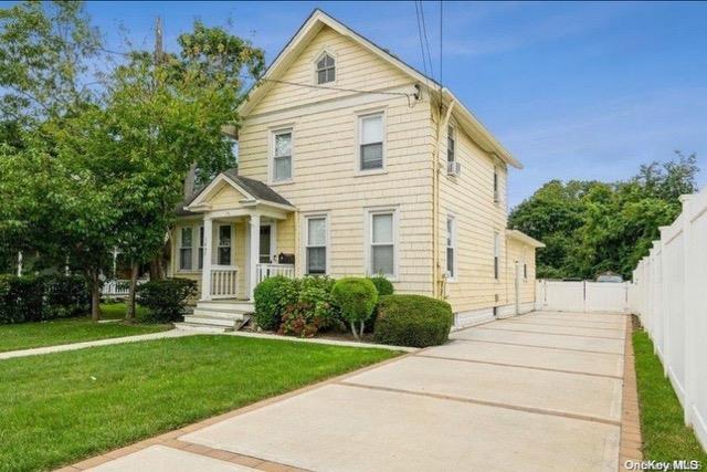 View of front of property with a front yard