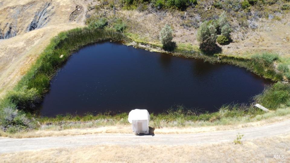 a backyard of a house with a yard and lake