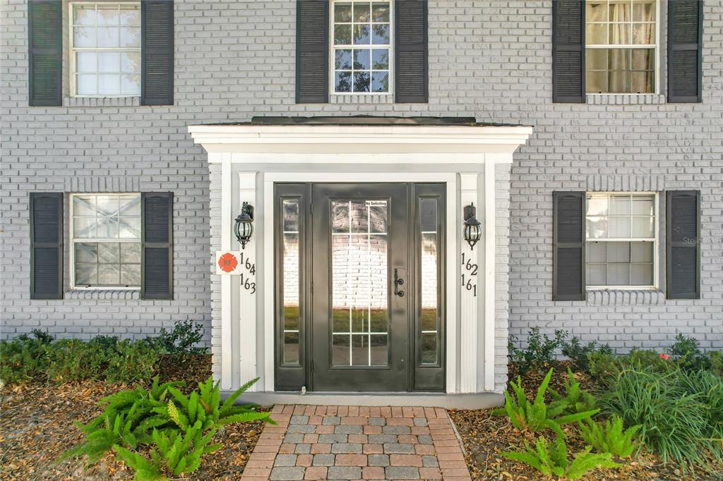 a front view of a house with a glass door