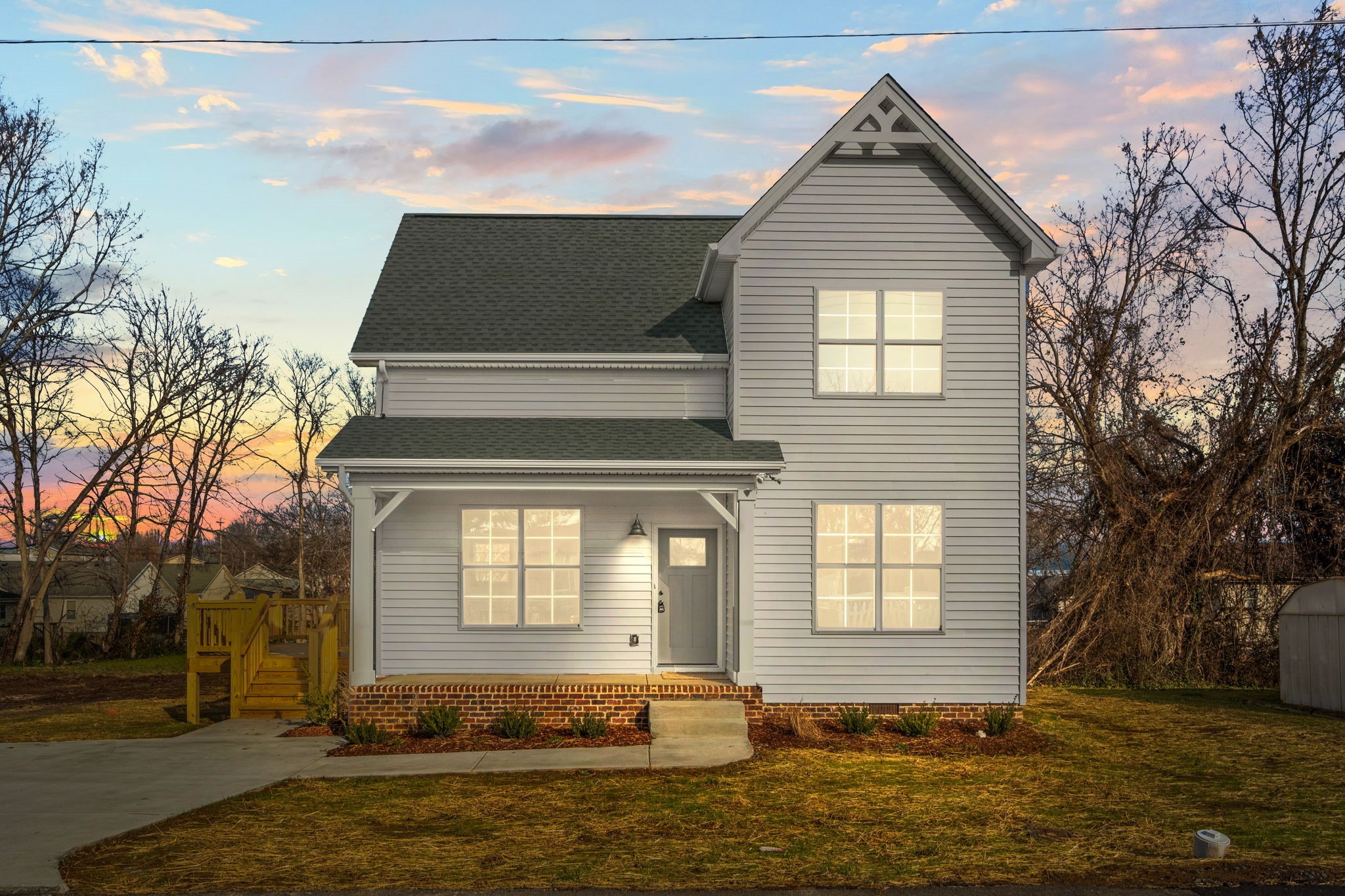 a front view of a house with a yard