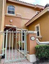 a front view of a house with parking space