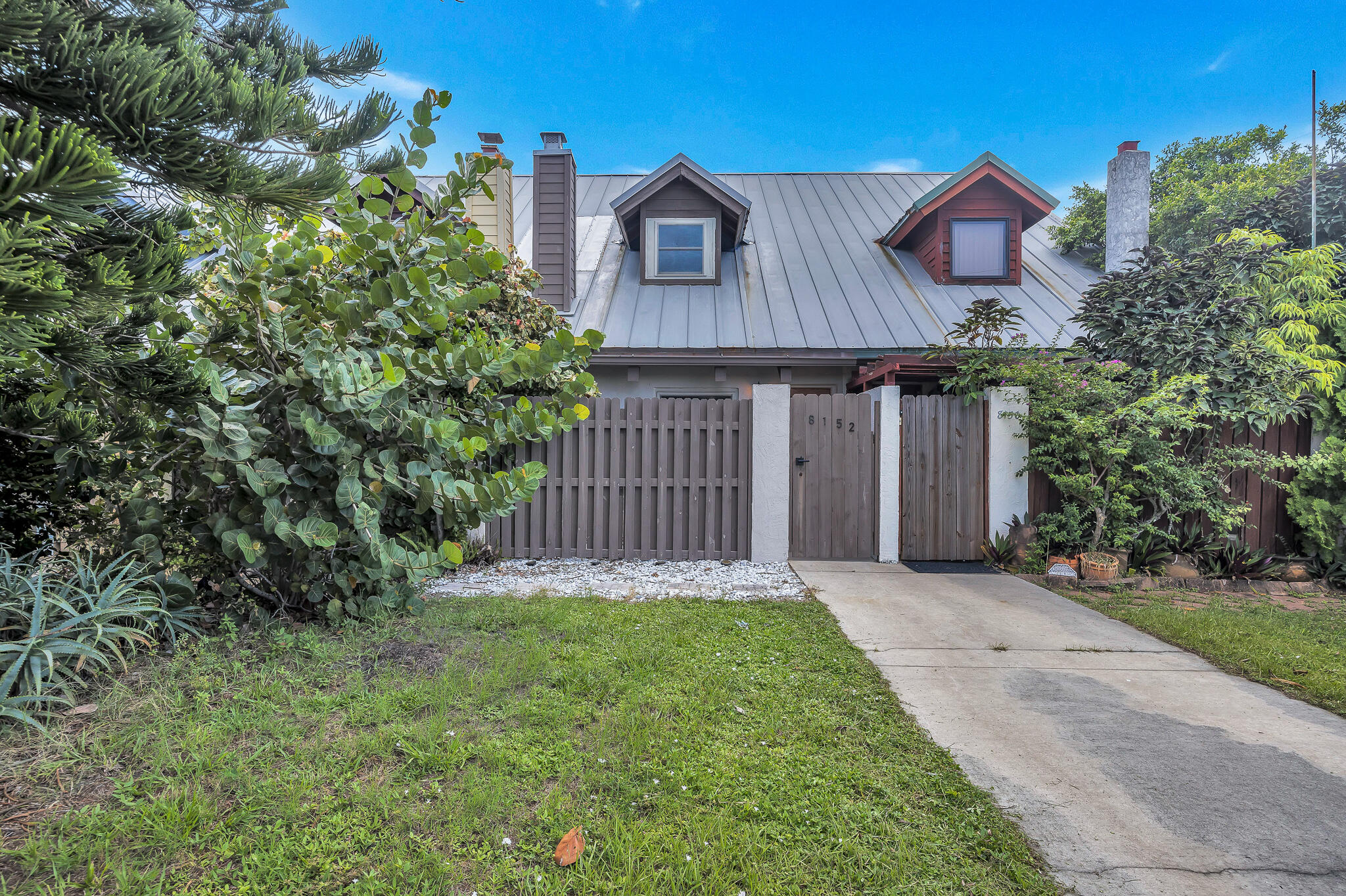 front view of a house with a yard