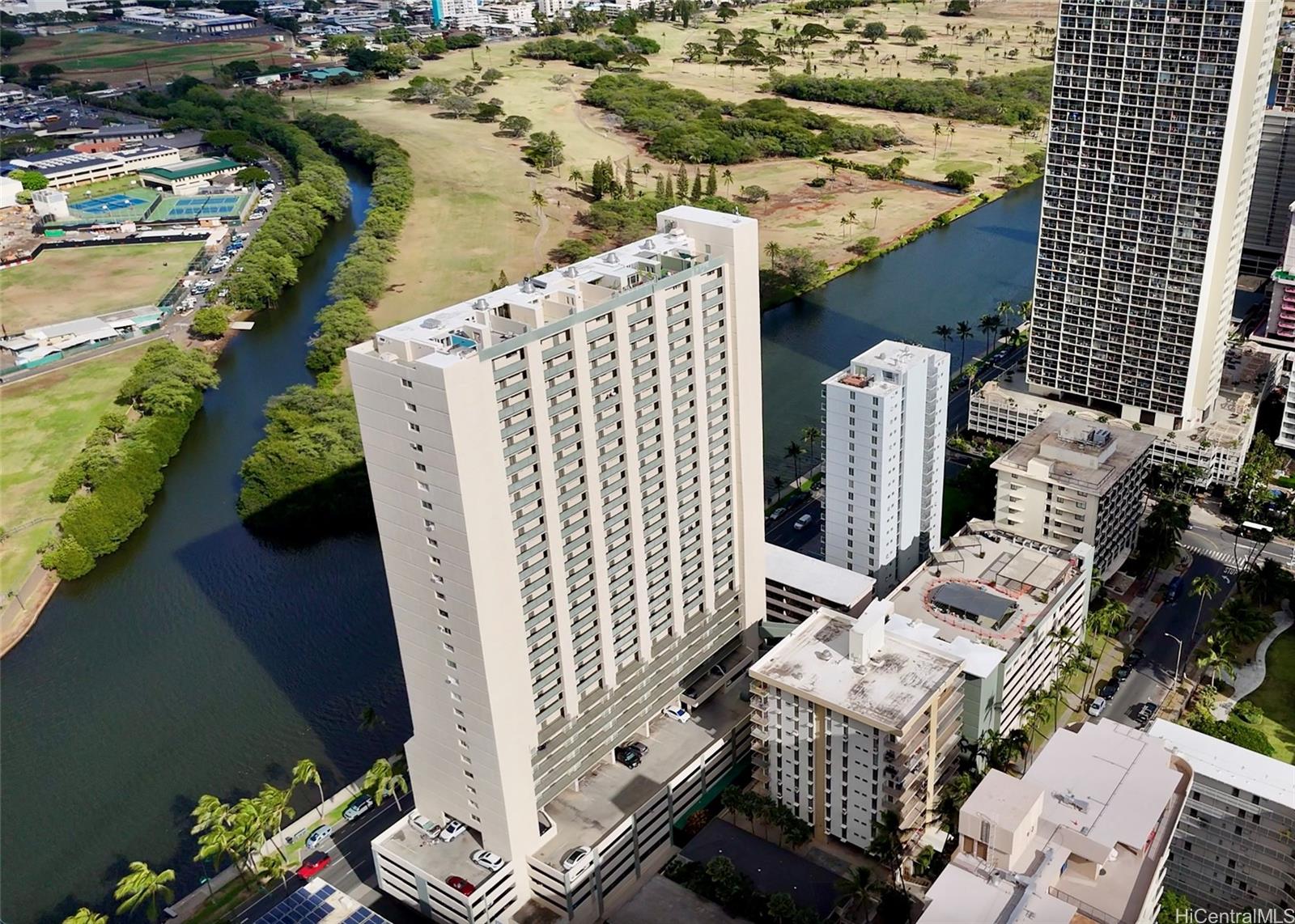 an aerial view of multiple houses with yard