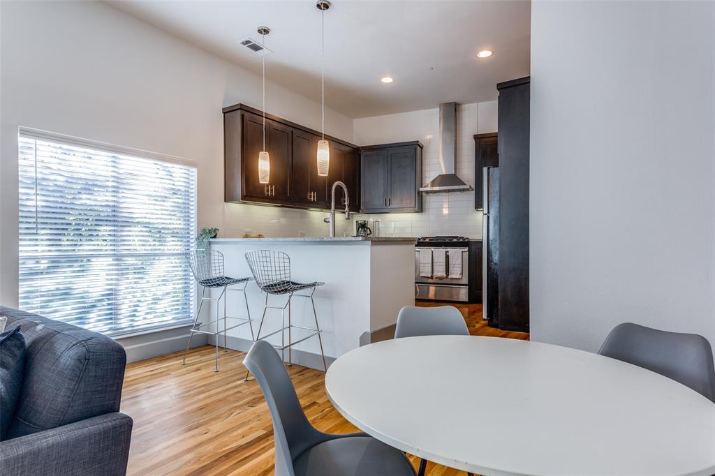 a view of kitchen with cabinets and wooden floor