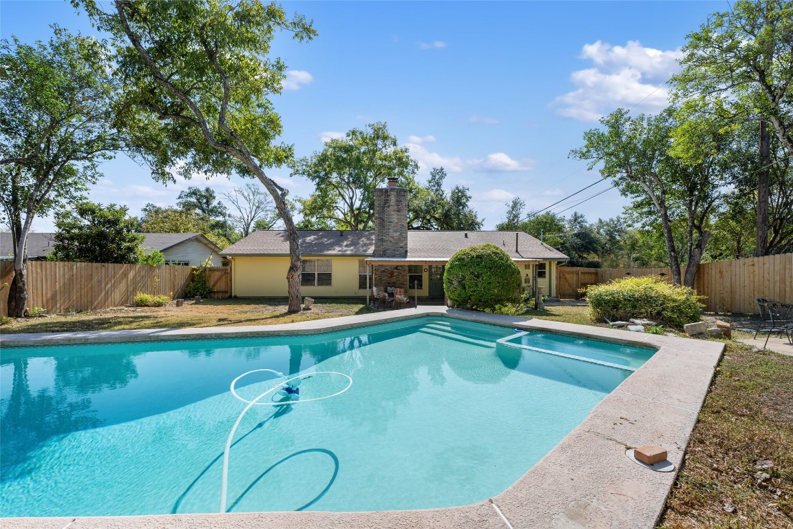 a view of a swimming pool with a patio