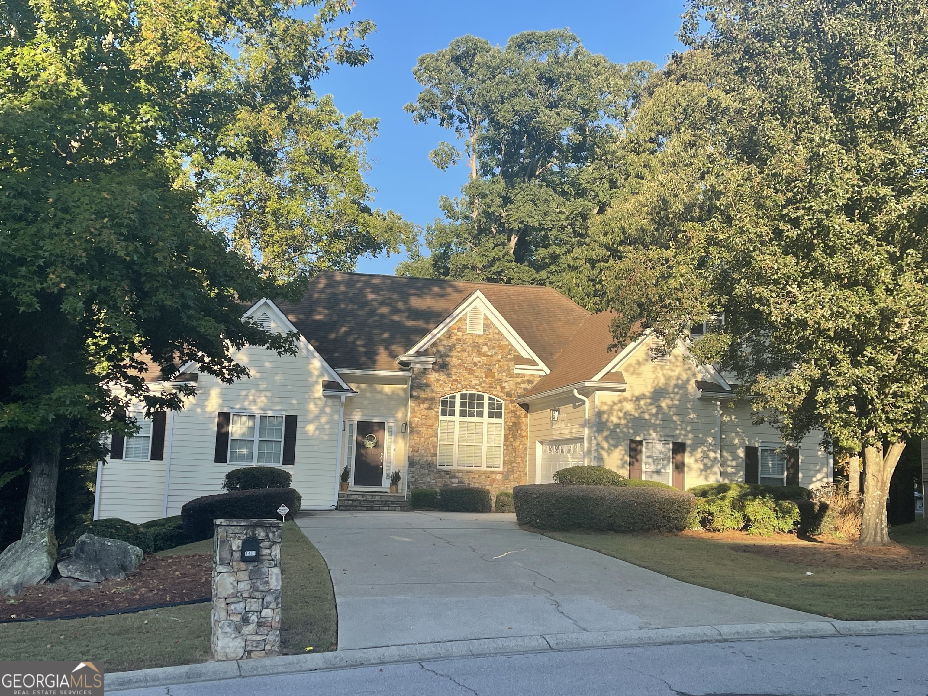 a front view of a house with a yard