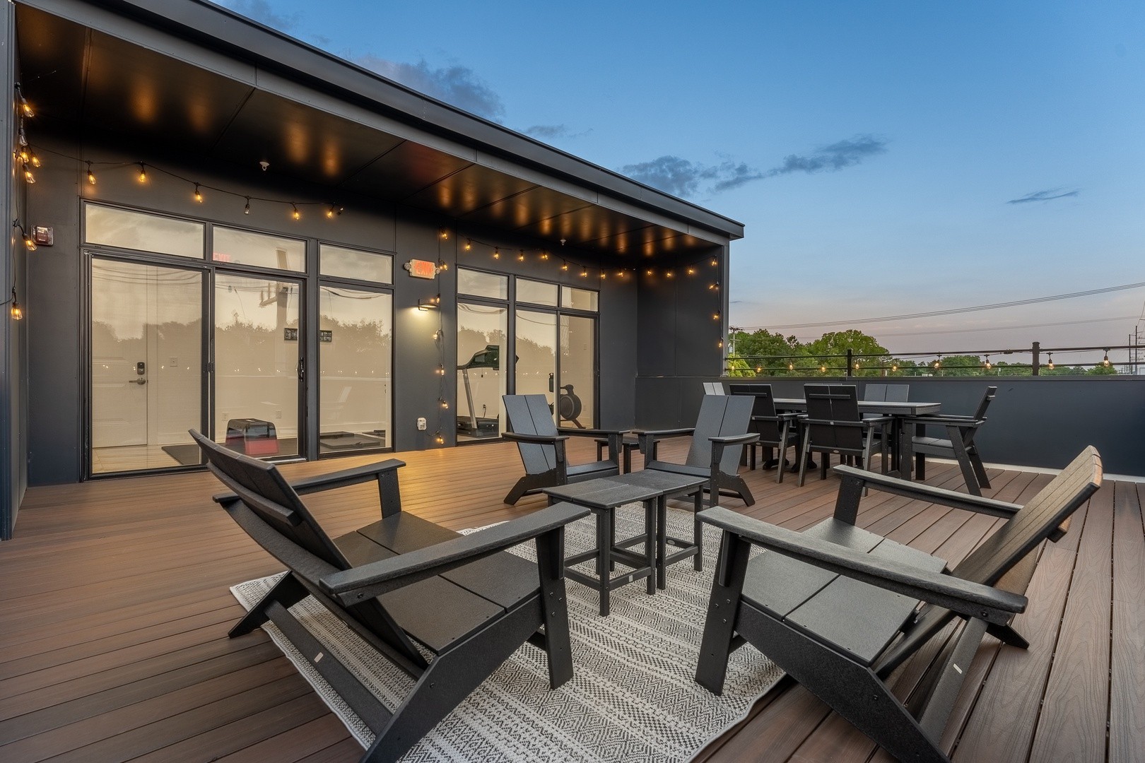 wooden roof deck with outdoor seating