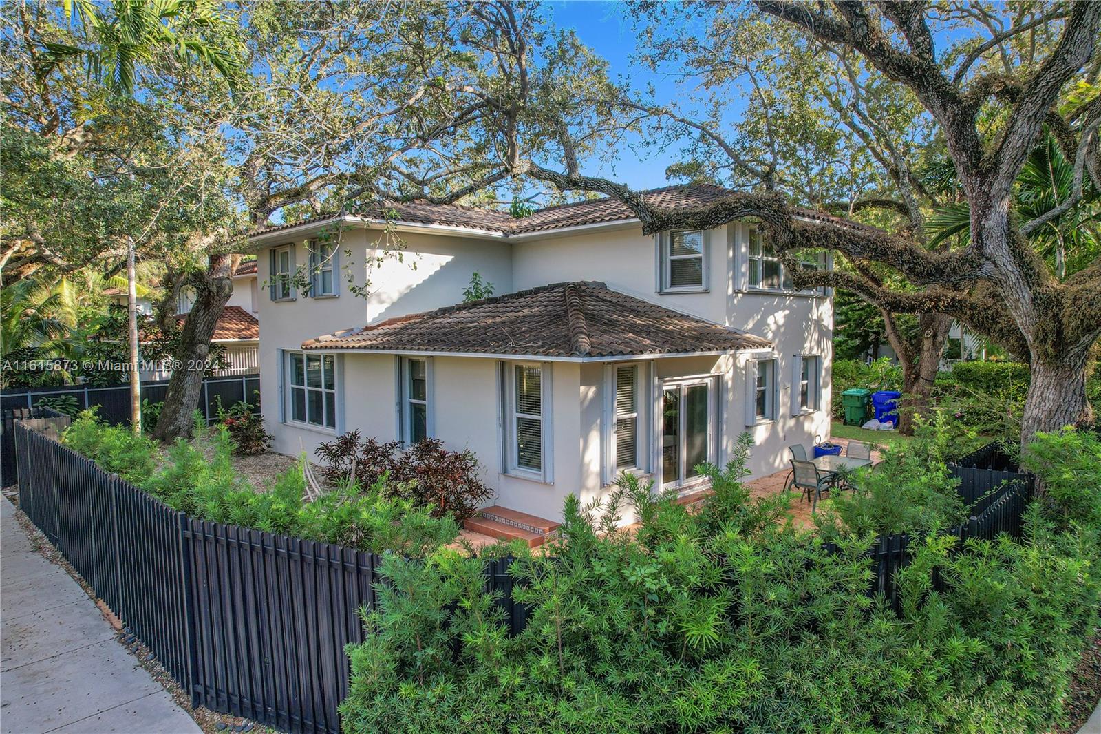 front view of a house with a garden