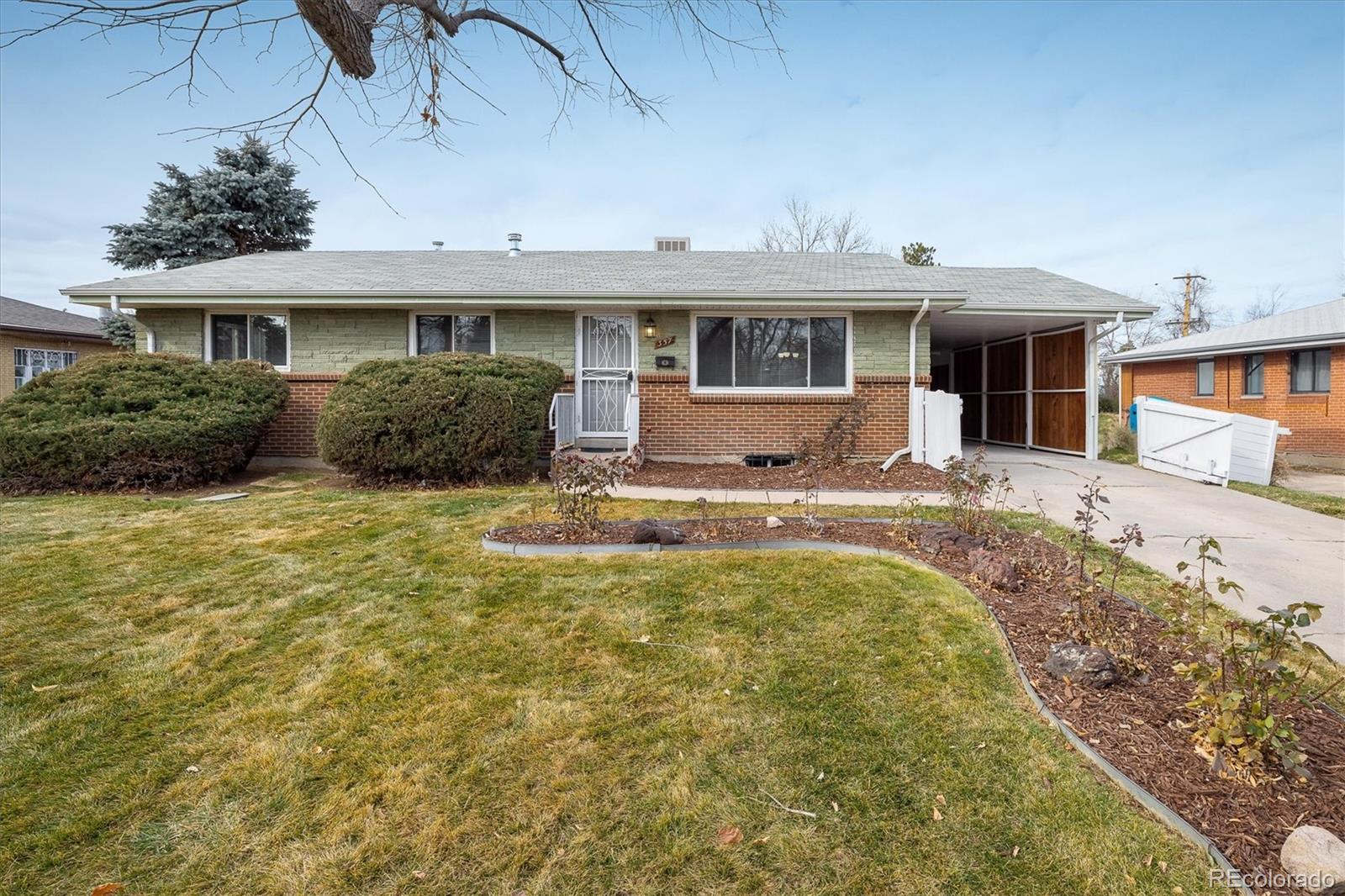 a view of house with outdoor seating