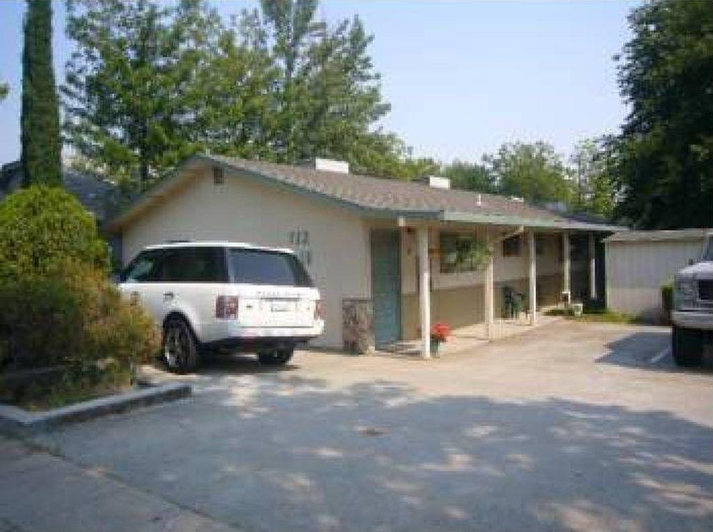 a car parked in front of a house