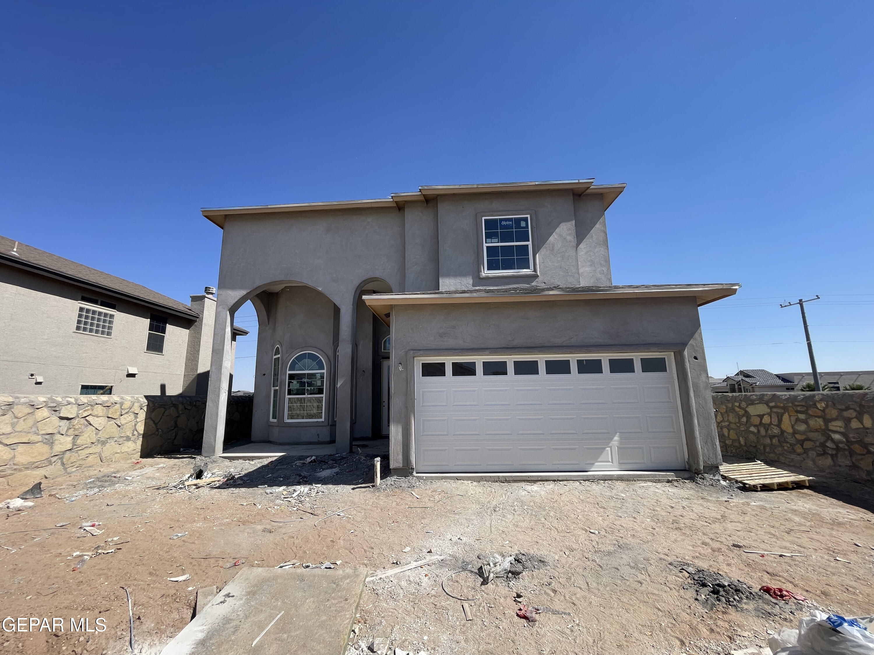 a front view of a house with a garage