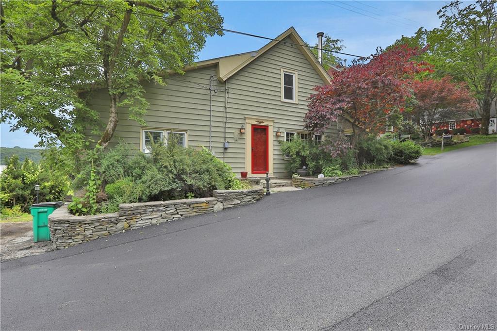 a view of a house with a street