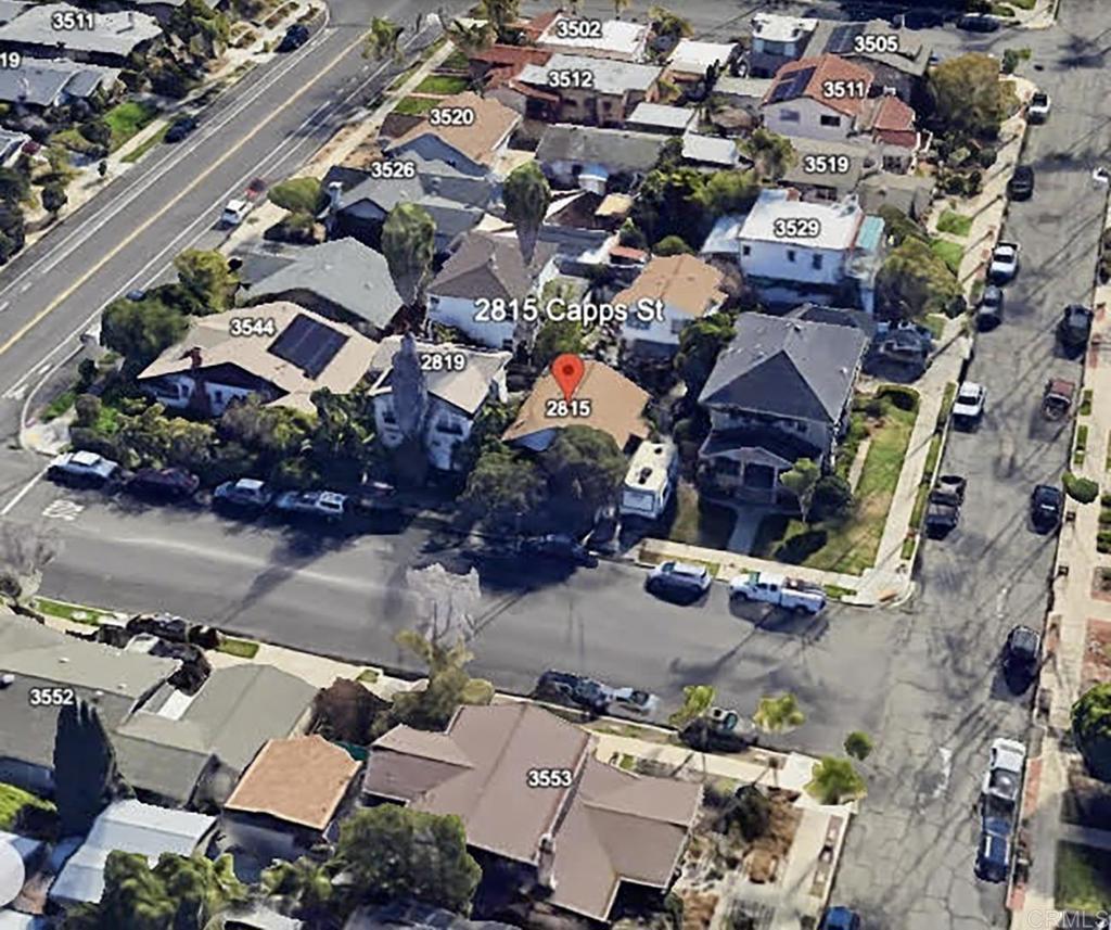 an aerial view of a houses with outdoor space