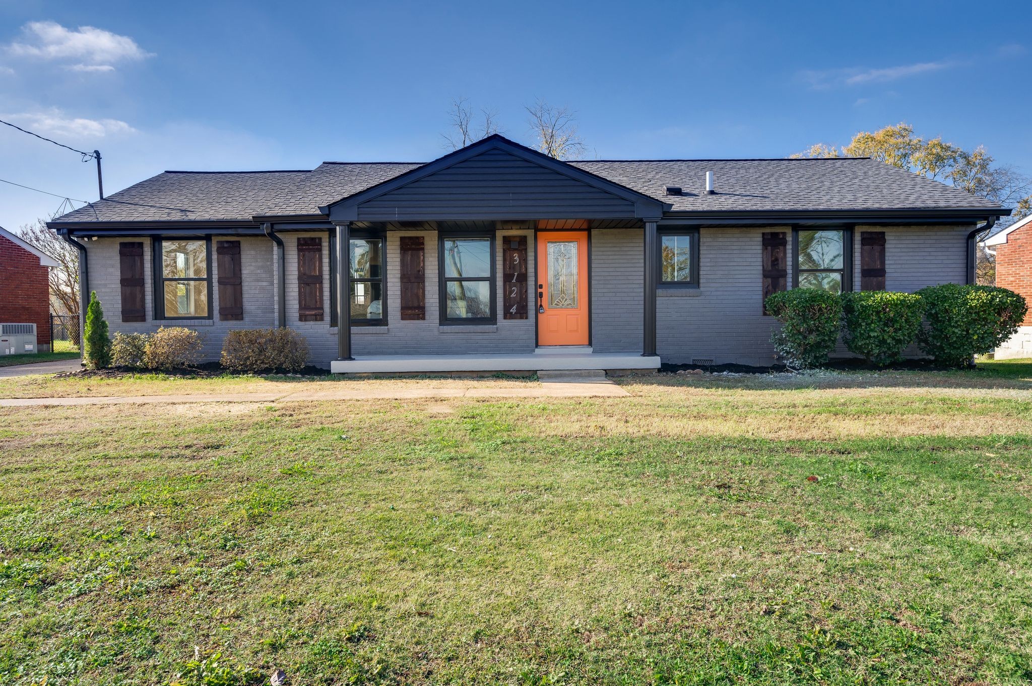 a front view of a house with a yard