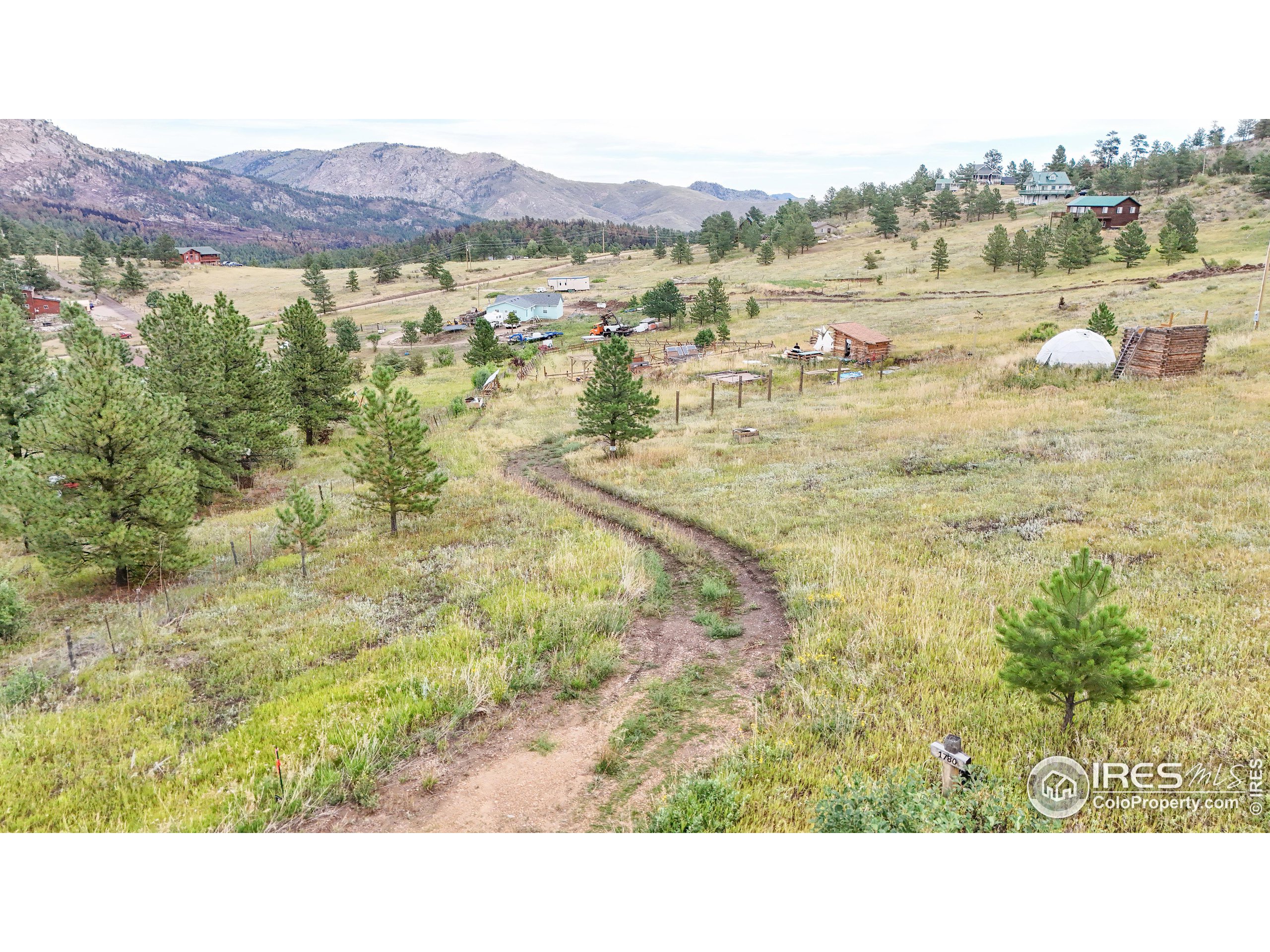 a open area with mountains in the background