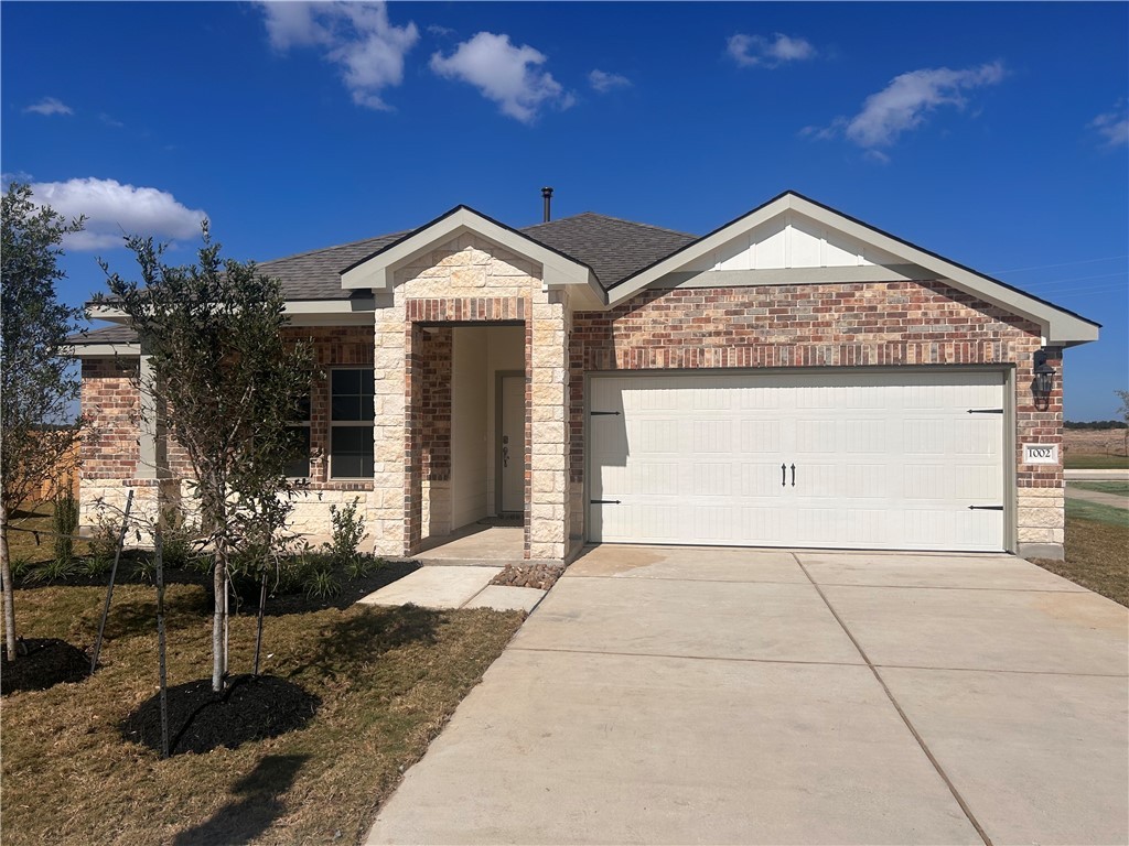 View of front of home featuring a garage