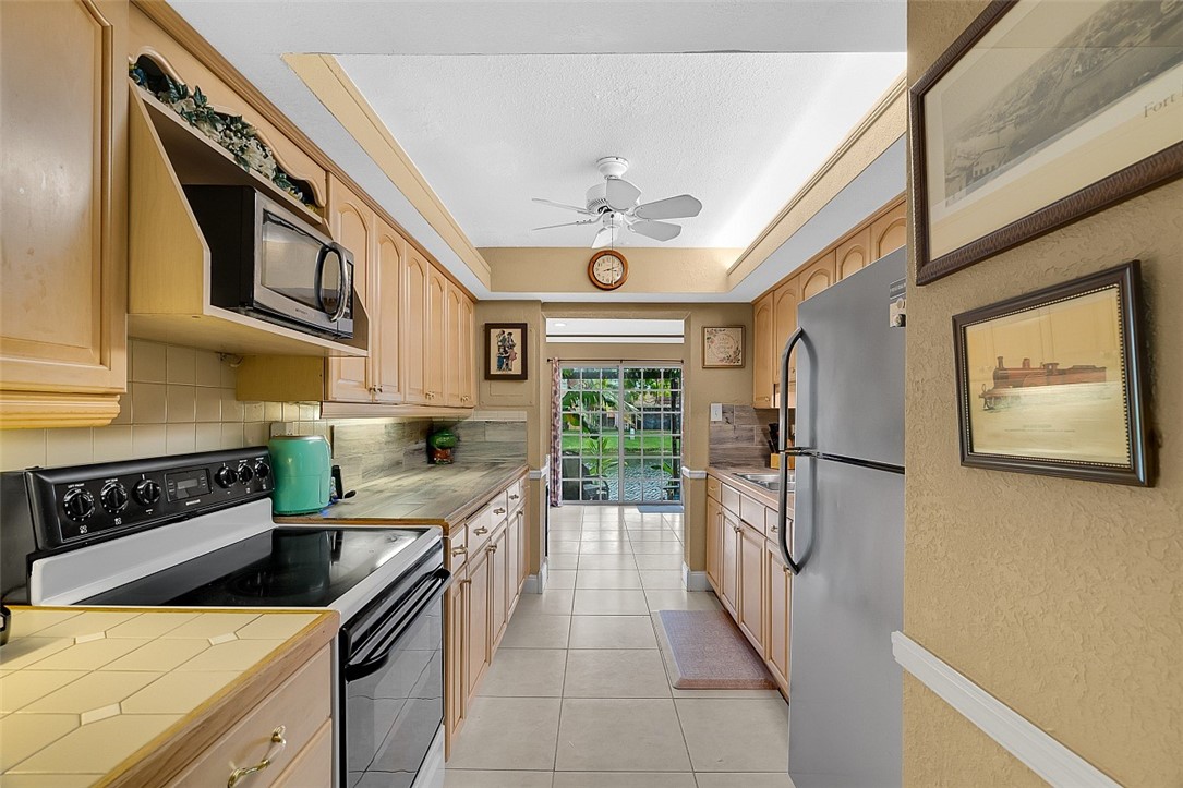 a kitchen with stainless steel appliances granite countertop a stove and a refrigerator