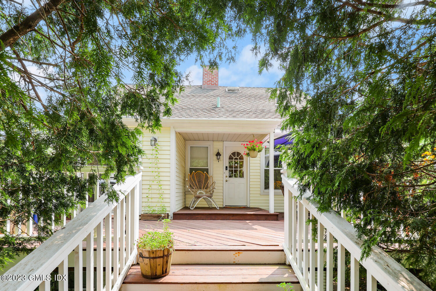 a view of a house with a tree