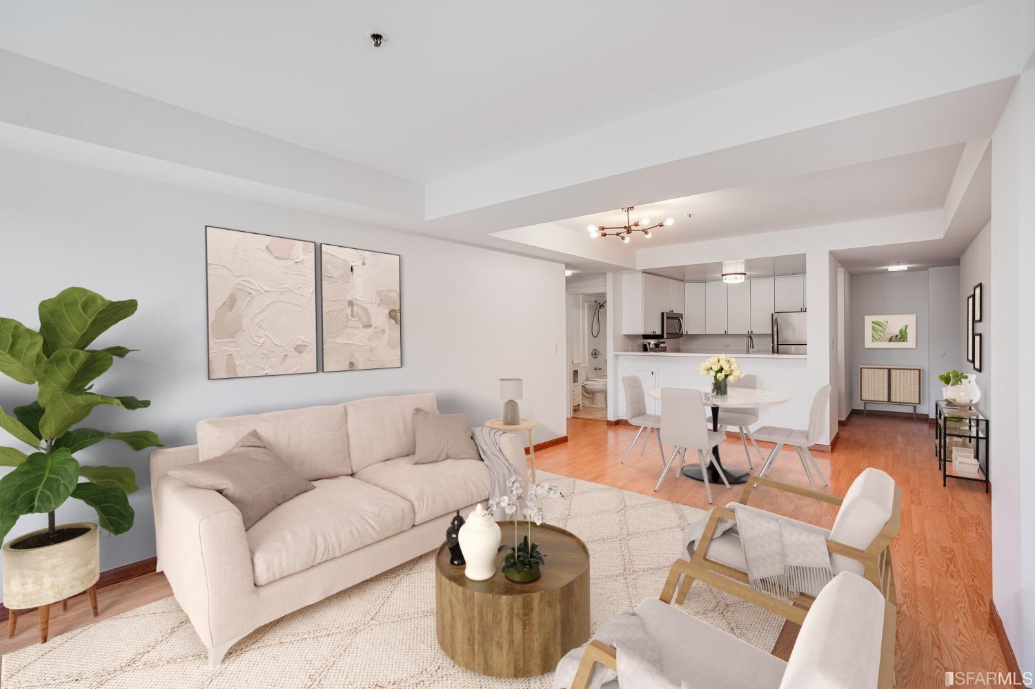 a living room with furniture and a painting on the wall