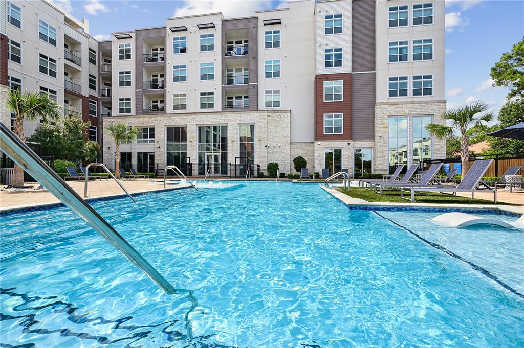 a view of a swimming pool with a lounge chairs