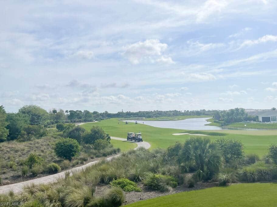 a view of a lake with houses in the back