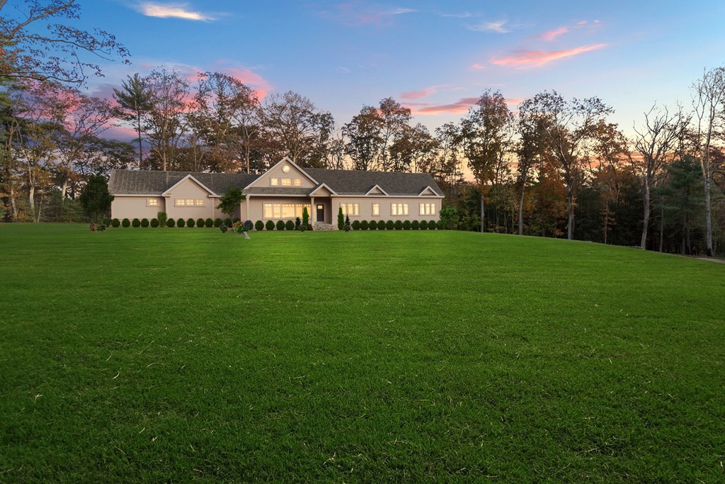 a front view of a house with a yard