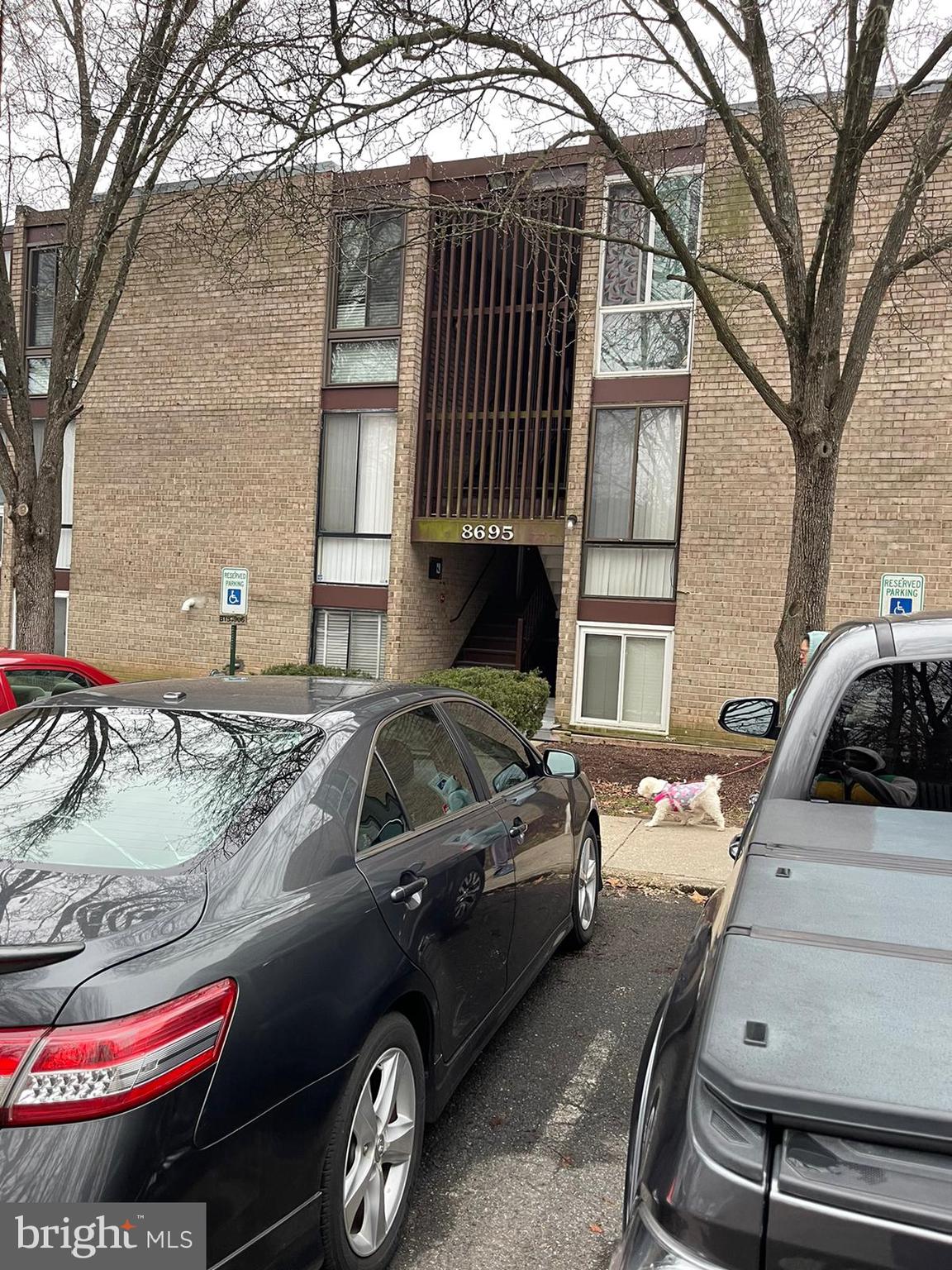 front view of a house with car parked