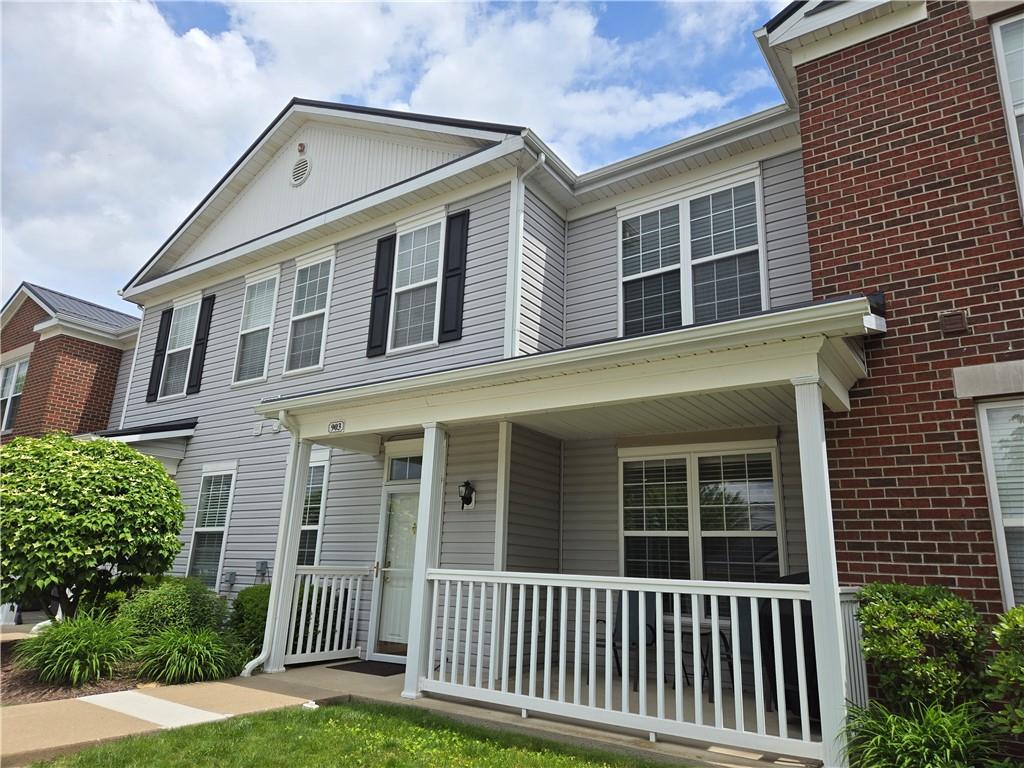 a front view of a house with a porch