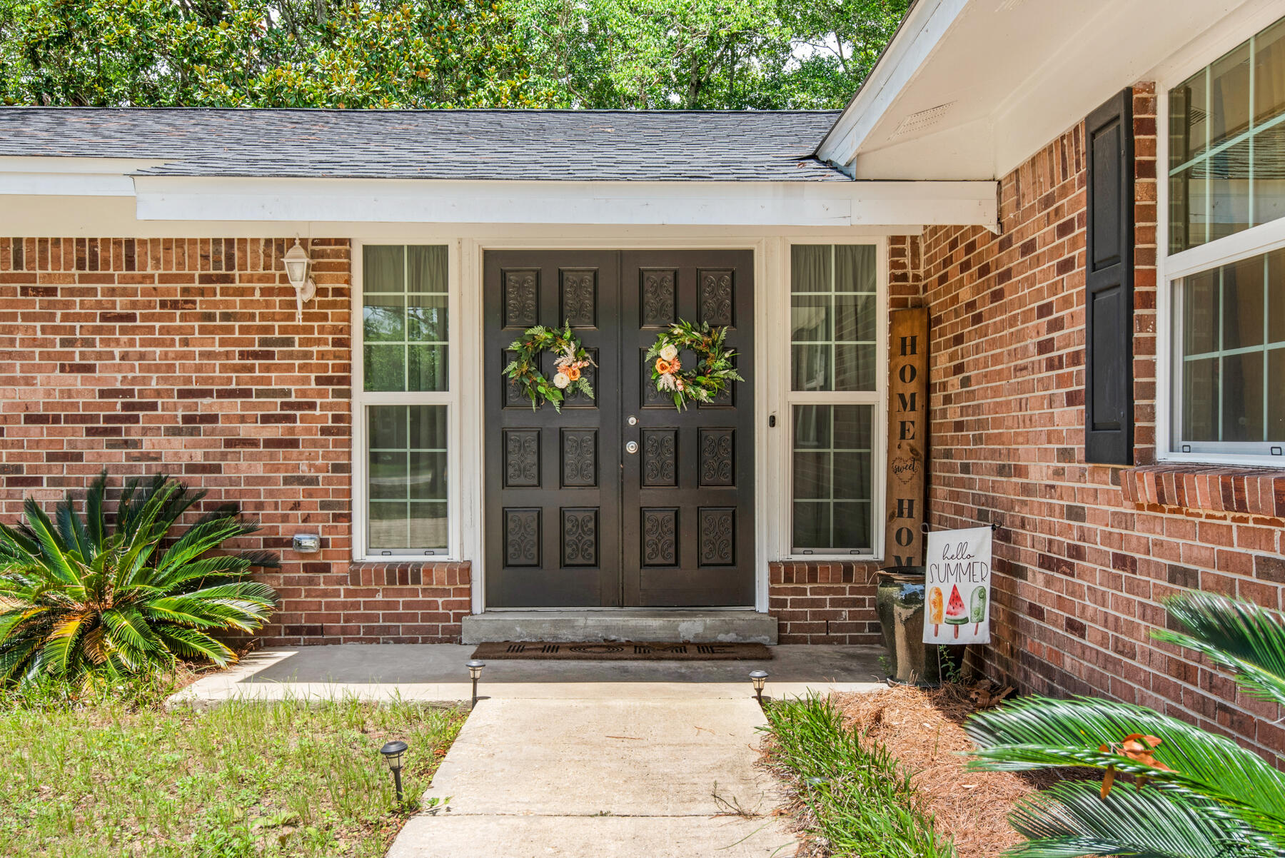 a front view of a house having garden