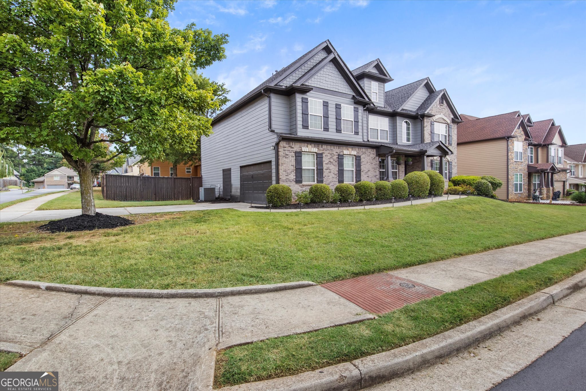 a front view of a house with a yard