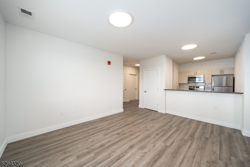 a view of kitchen with wooden floor