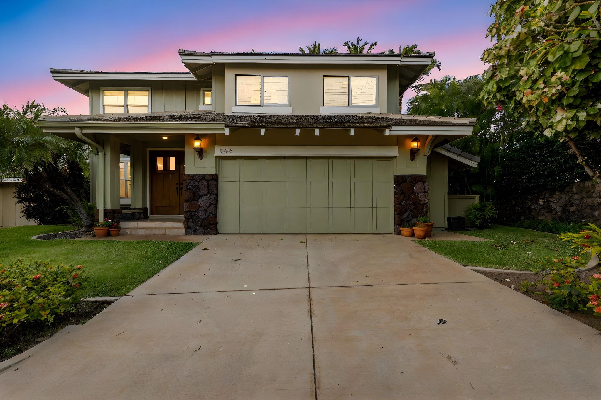 a front view of a house with garden