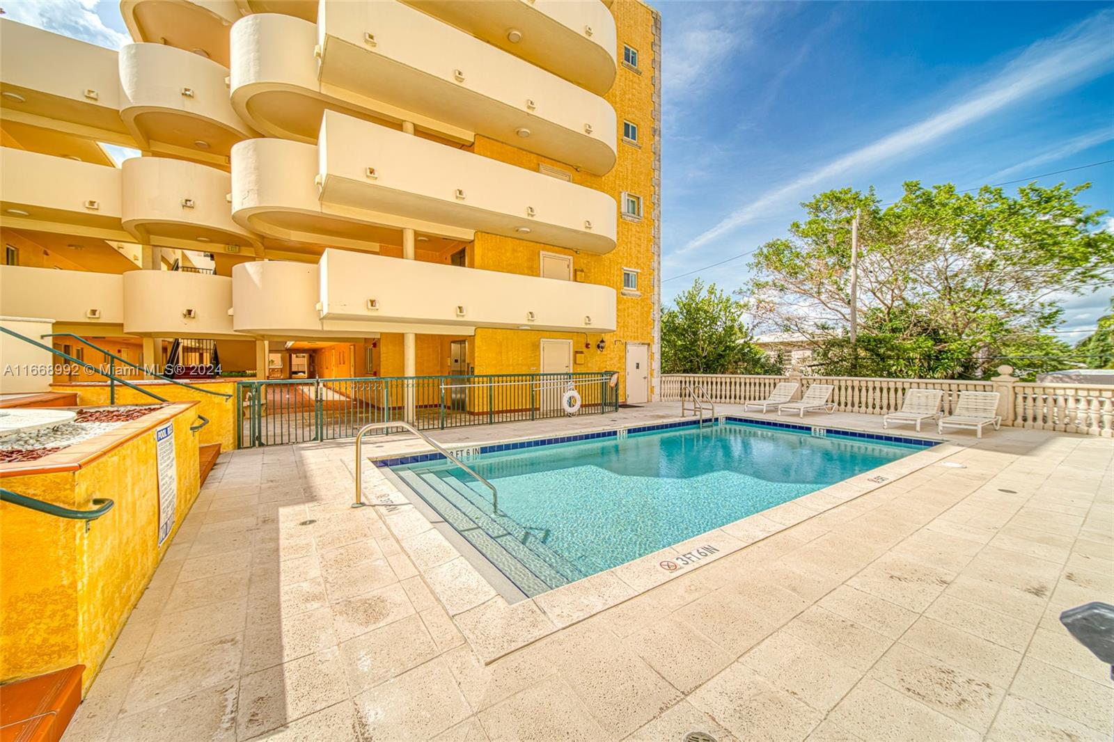 a view of swimming pool with chairs