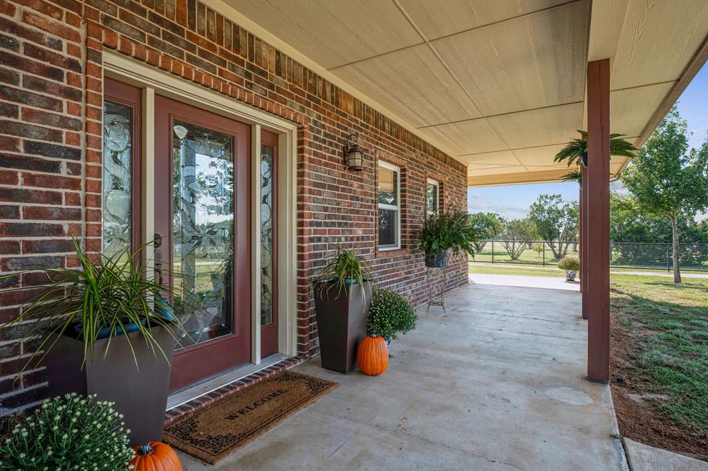 a view of backyard with plants and outdoor seating