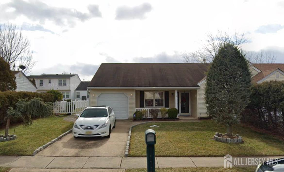 a house view with a seating space and garden