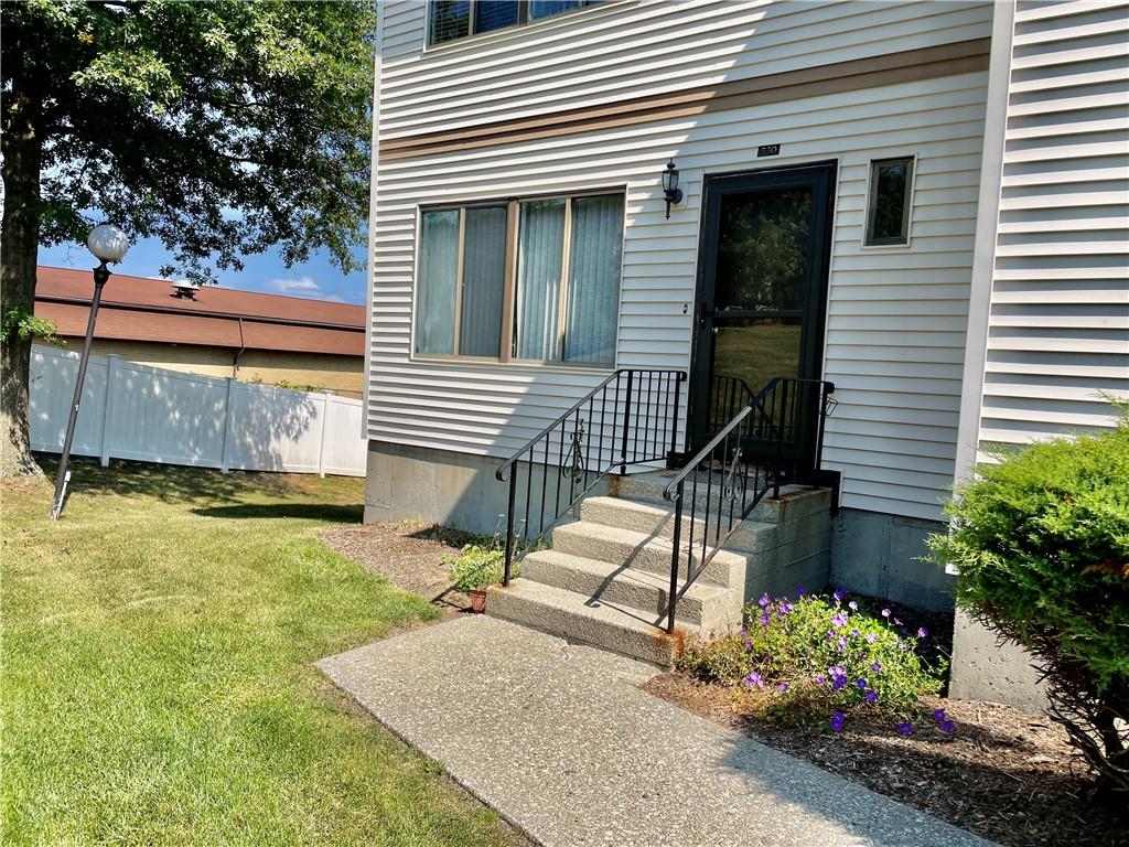 Property entrance featuring a lawn