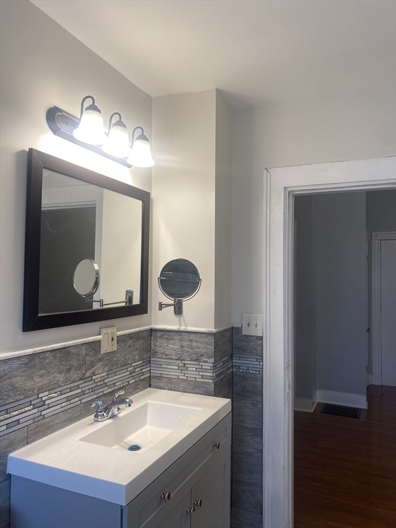 a bathroom with a sink and a mirror