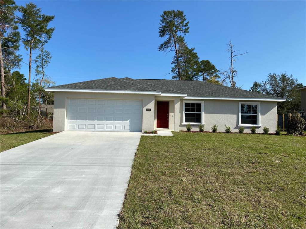 front view of a house with a yard