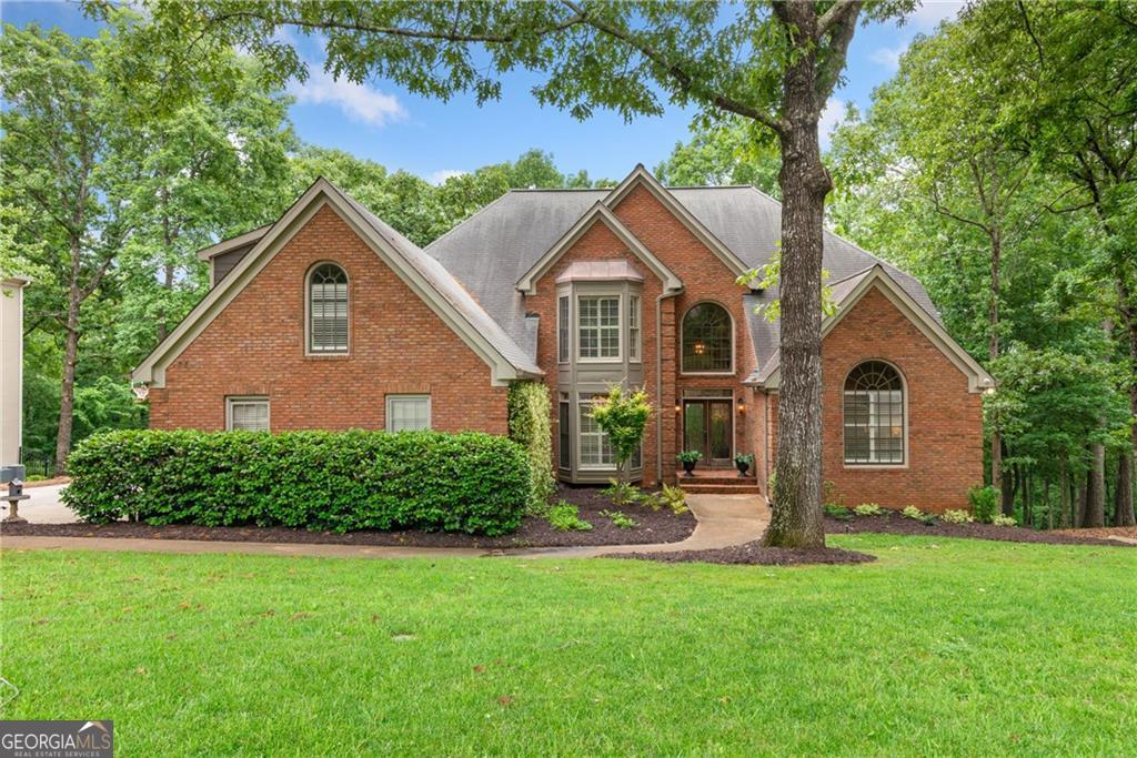 a front view of a house with a yard