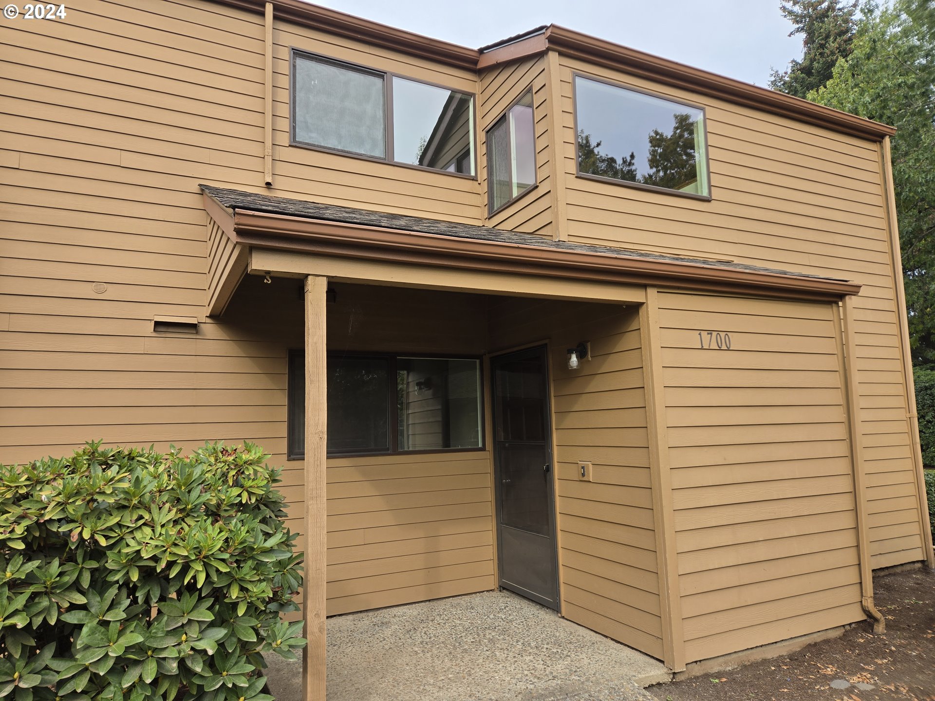 a view of a house with a window and door