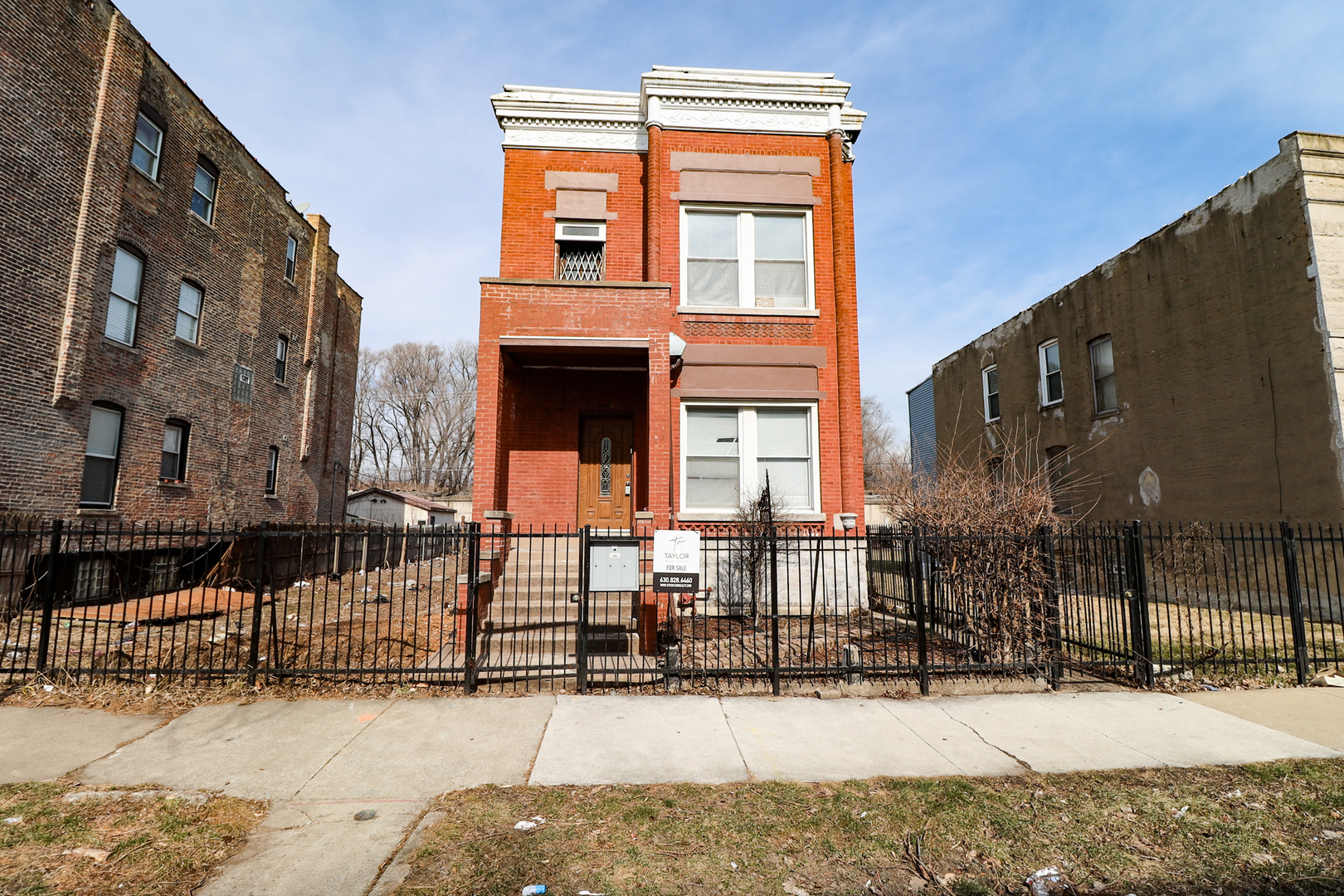 a view of a brick building with many windows