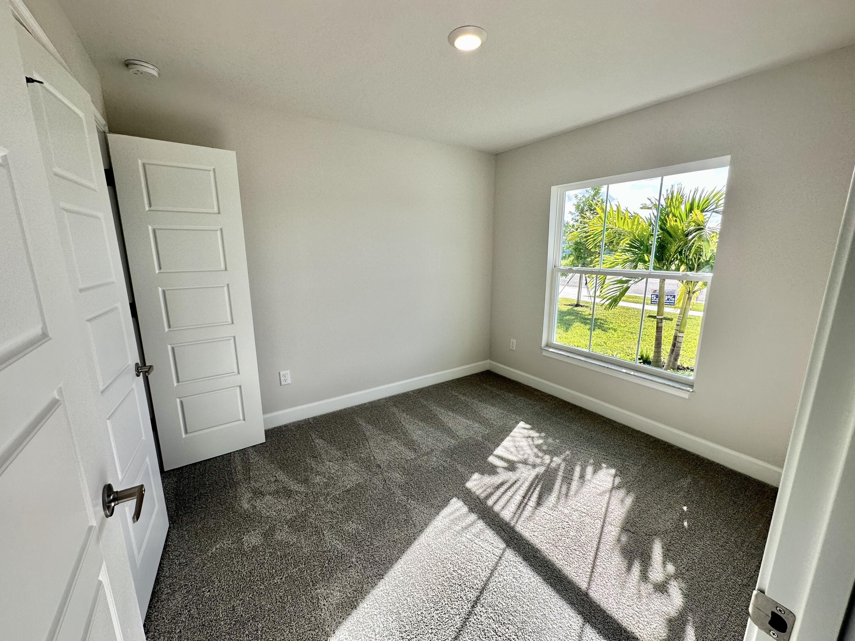 a view of an empty room and window