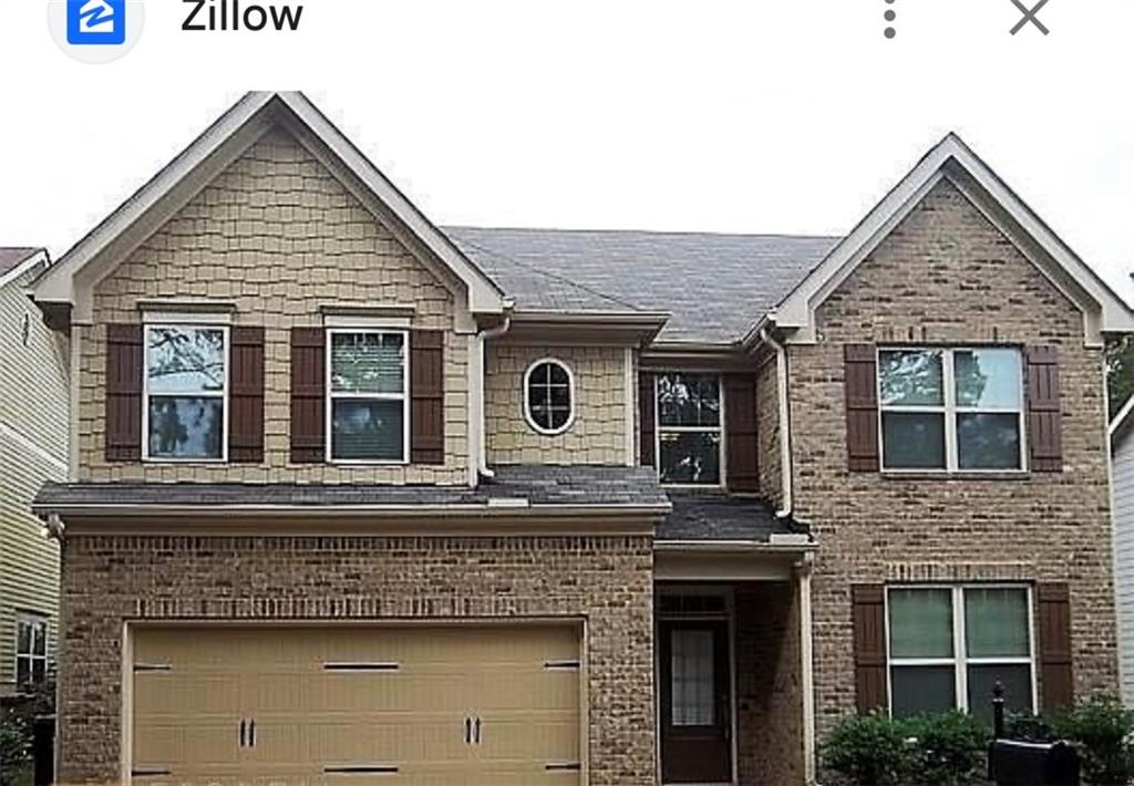 a view of a house with large windows