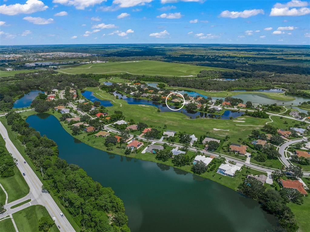 a view of a golf course with a lake