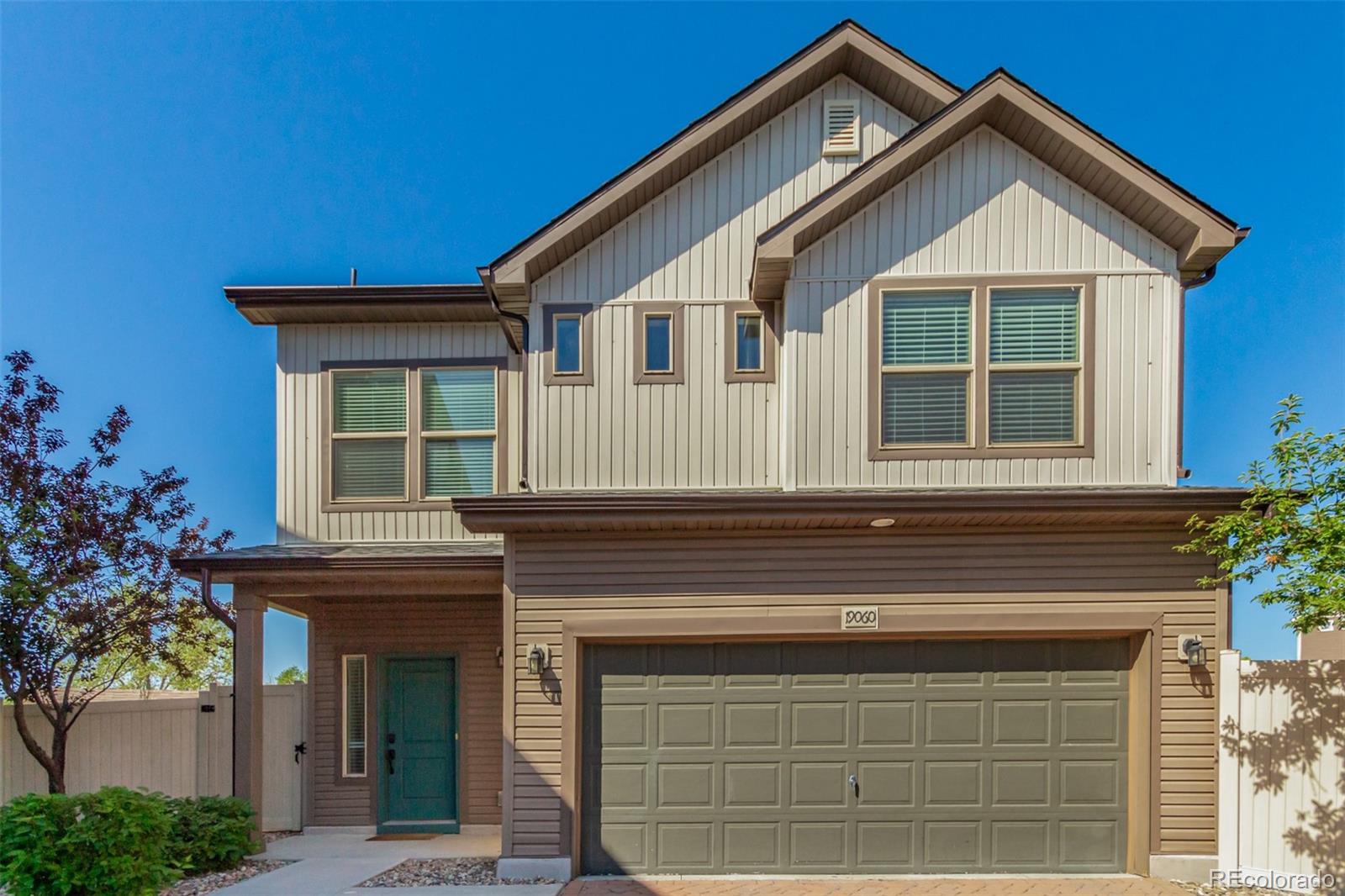 a front view of a house with a garage