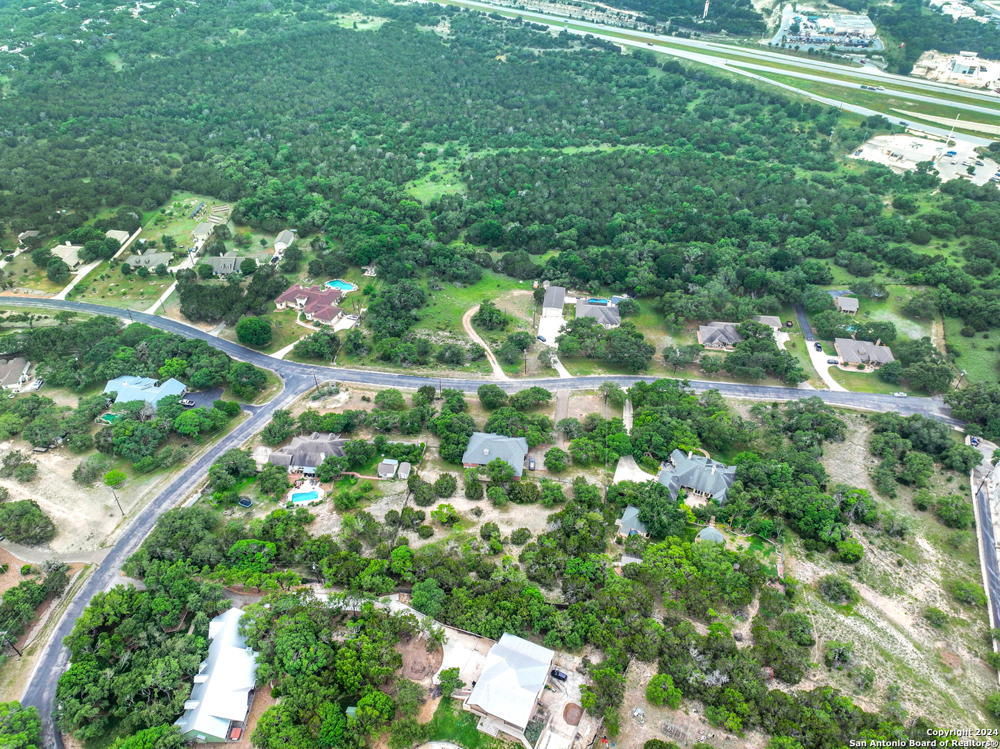 a view of a yard with a tree