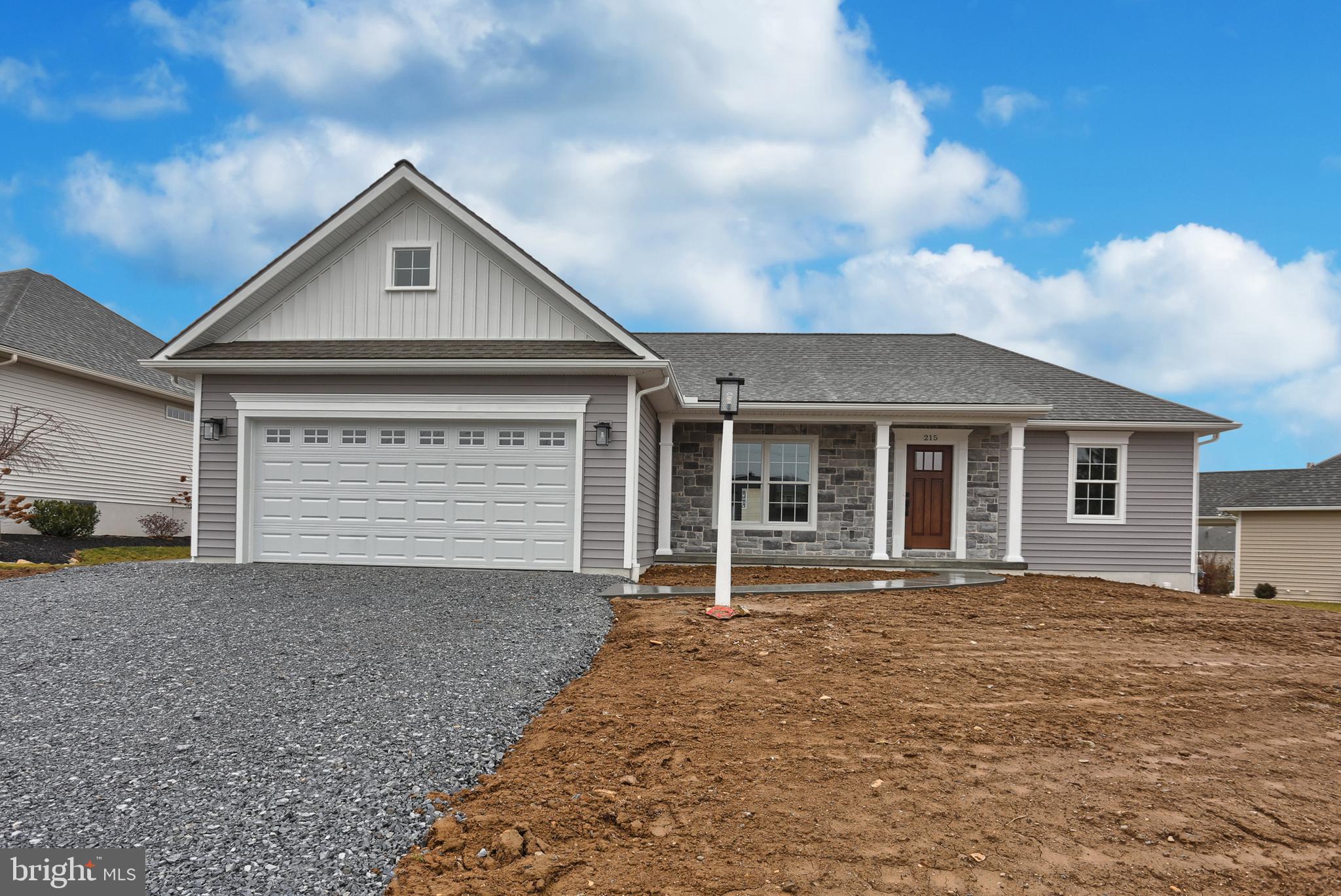 a front view of a house with yard