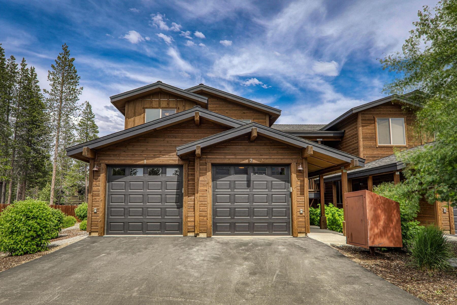 a front view of a house with a garage