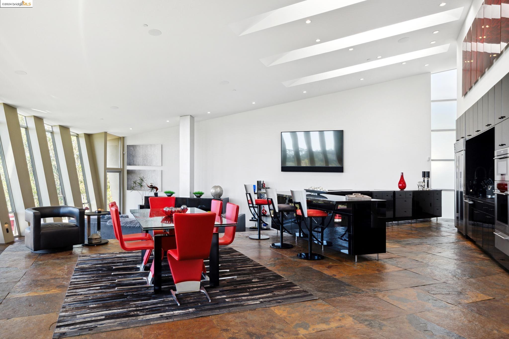 a living room filled with furniture and a flat screen tv